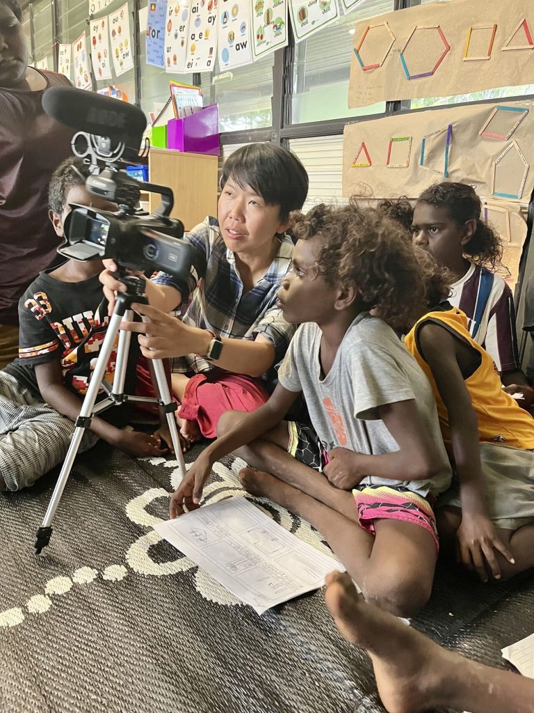 Associate Professor Li Ping Thong teaching video production to Yolŋu community at Garrthalala homeland as part of the Community Banashi Project.