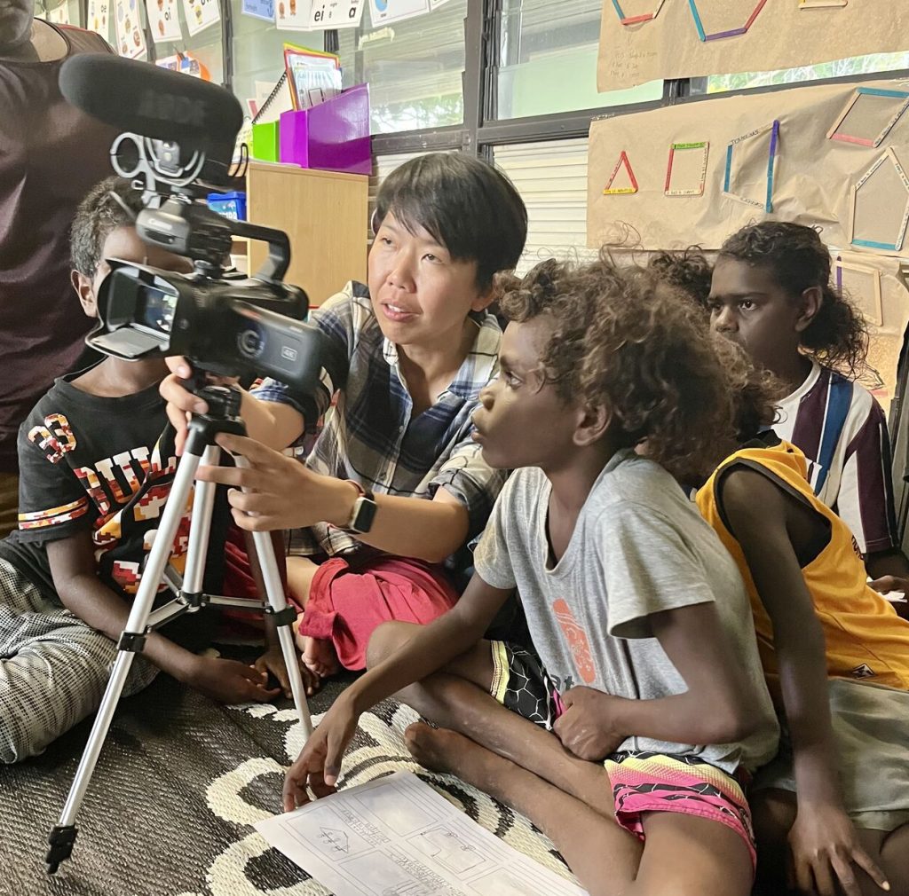 Associate Professor Li Ping Thong teaching video production to Yolŋu community at Garrthalala homeland as part of the Community Banashi Project.
