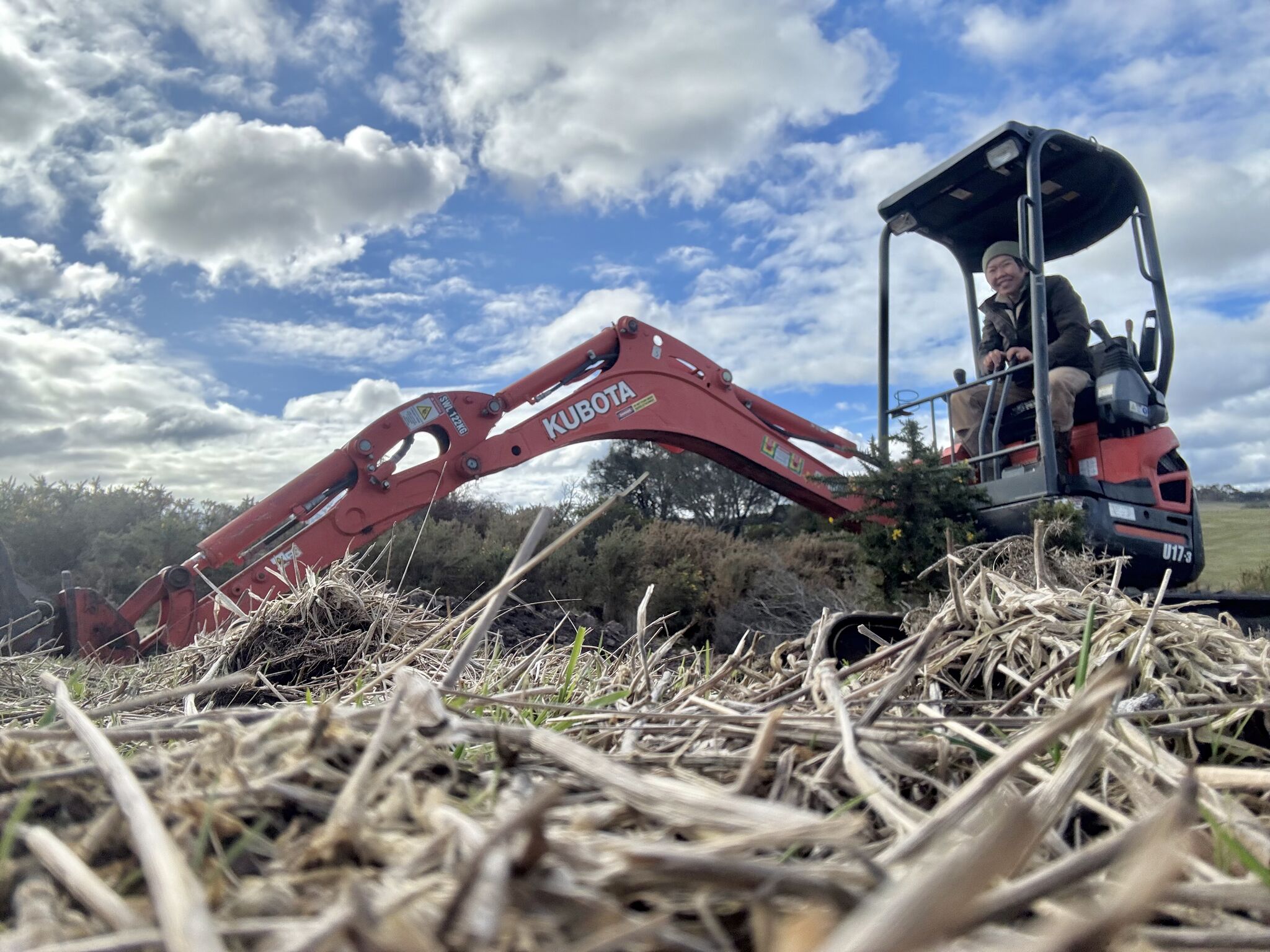 Li Ping Thong on a mini tractor.