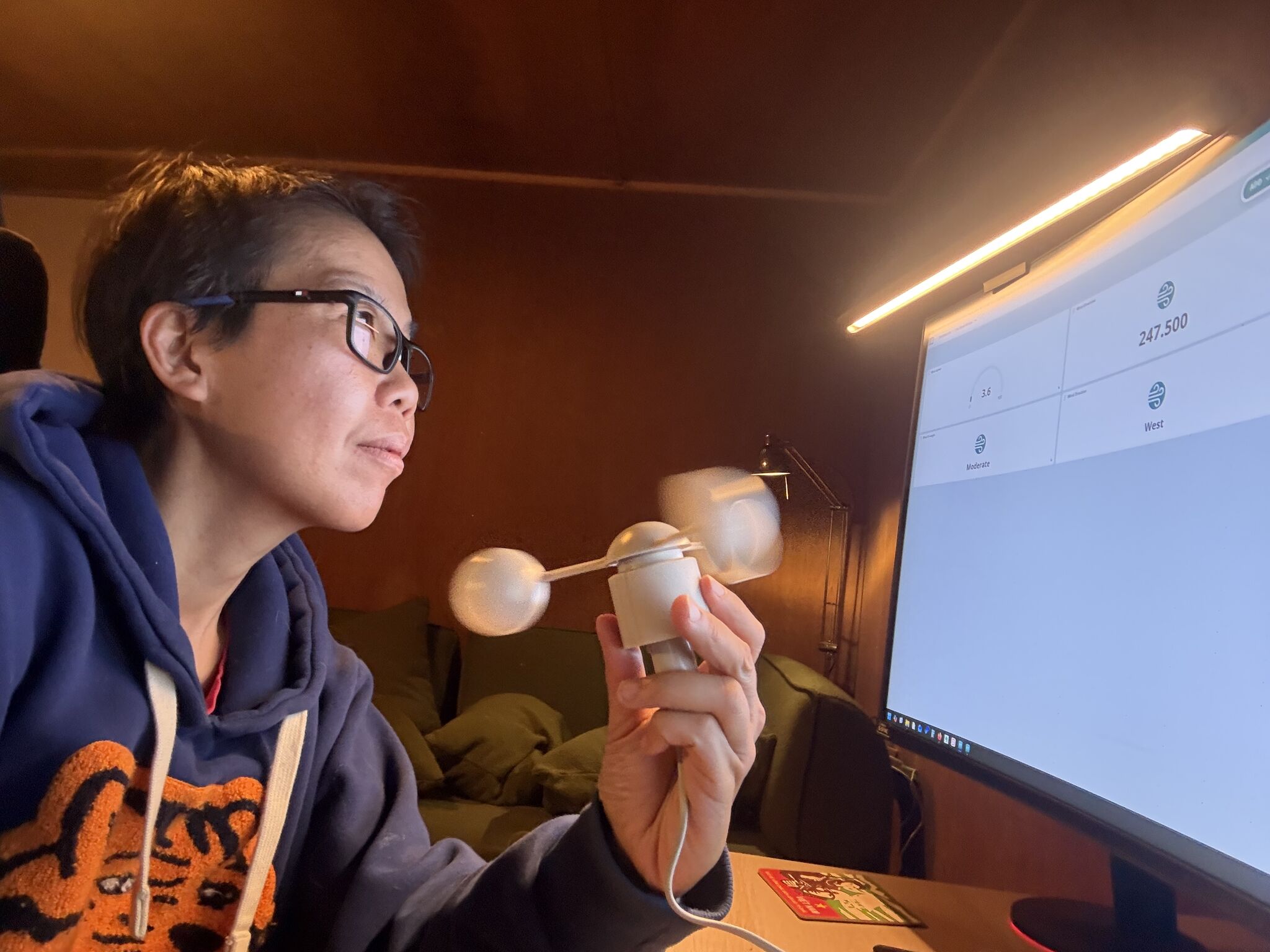 Li Ping Thong testing wind vane with data on computer